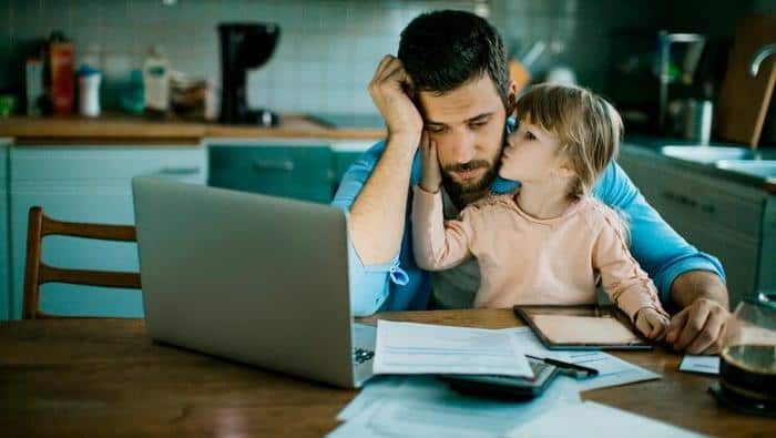 Father and daughter sitting in the kitchen