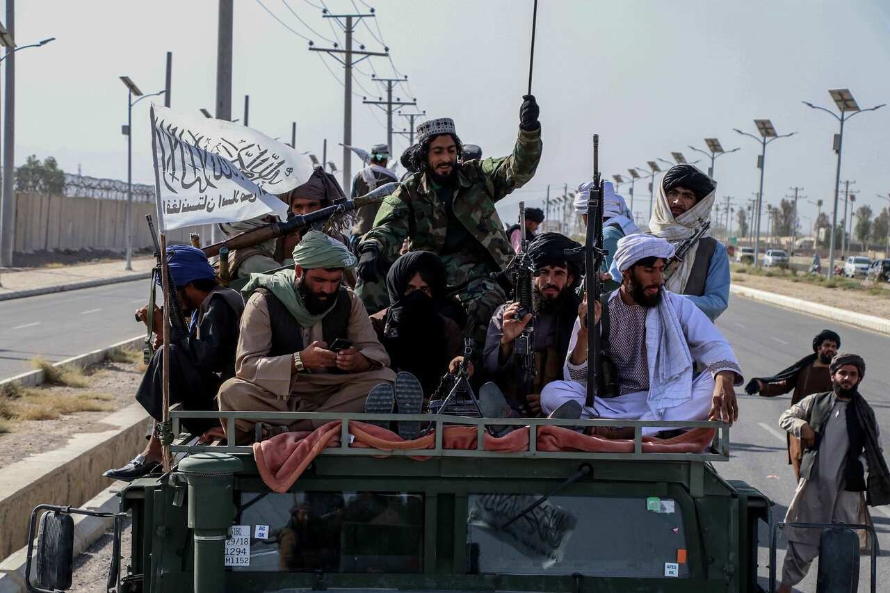 Taliban forces rally to celebrate the withdrawal of US forces in Kandahar 