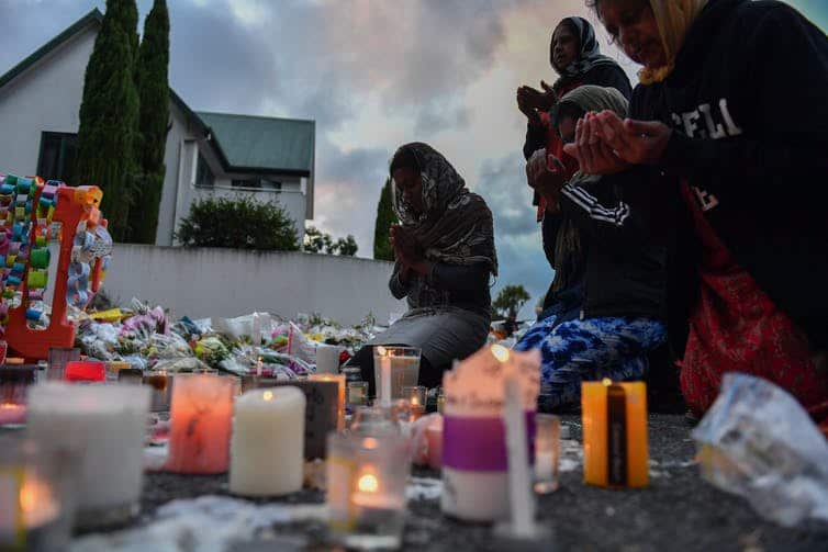 Worshippers pray at a makeshift memorial at the Al Noor Mosque in Christchurch on March 19.