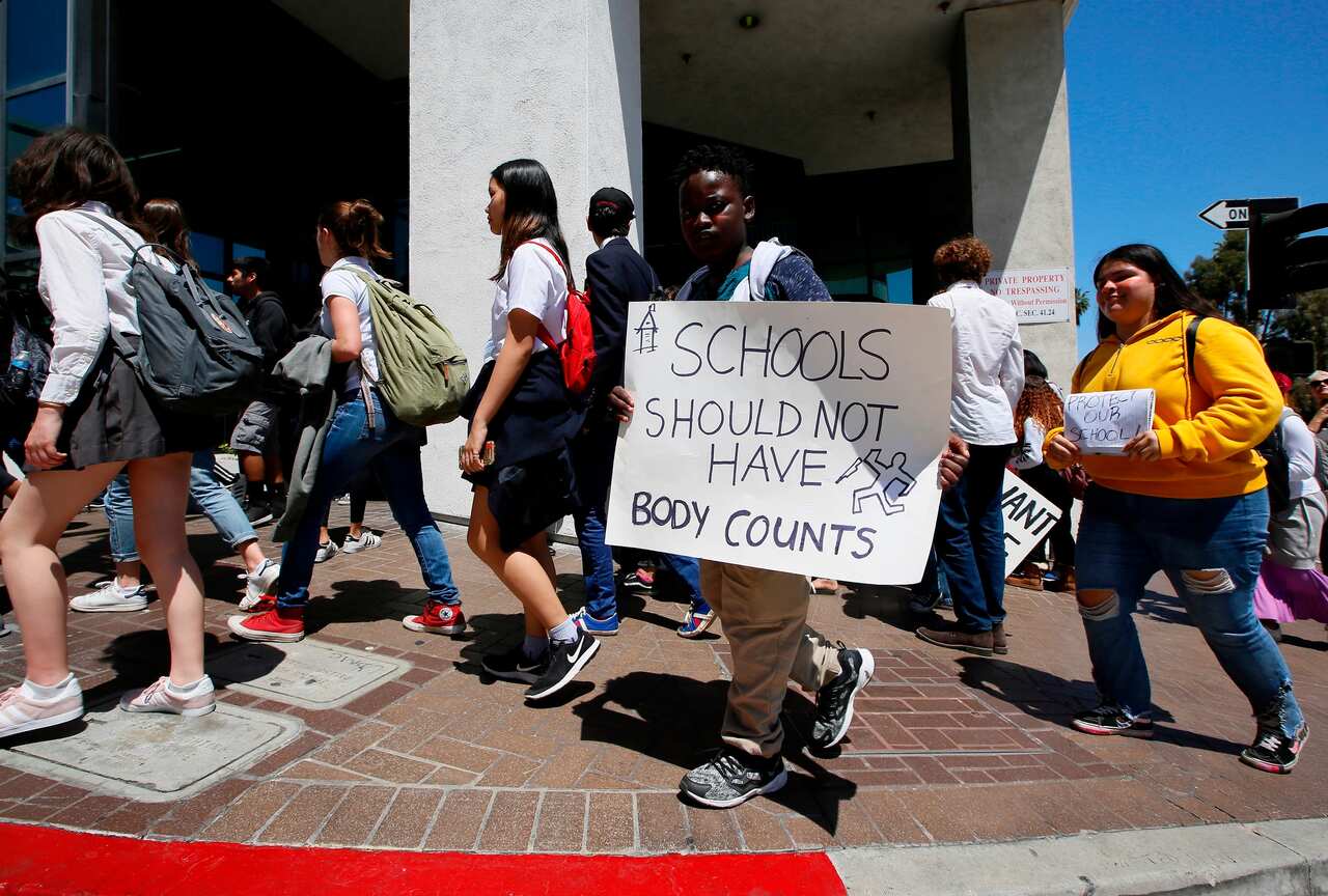 11-year-old student, Abdul Diop, joins a walking out of school to rally against gun violence on the 19th anniversary of the Columbine High School in 2018.