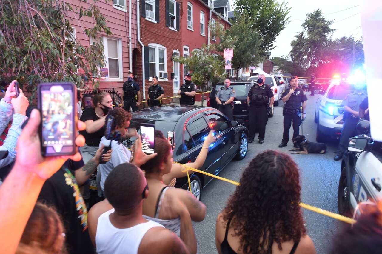 Protestors gather at the scene of a police shooting in Lancaster city, Pennsylvania. 