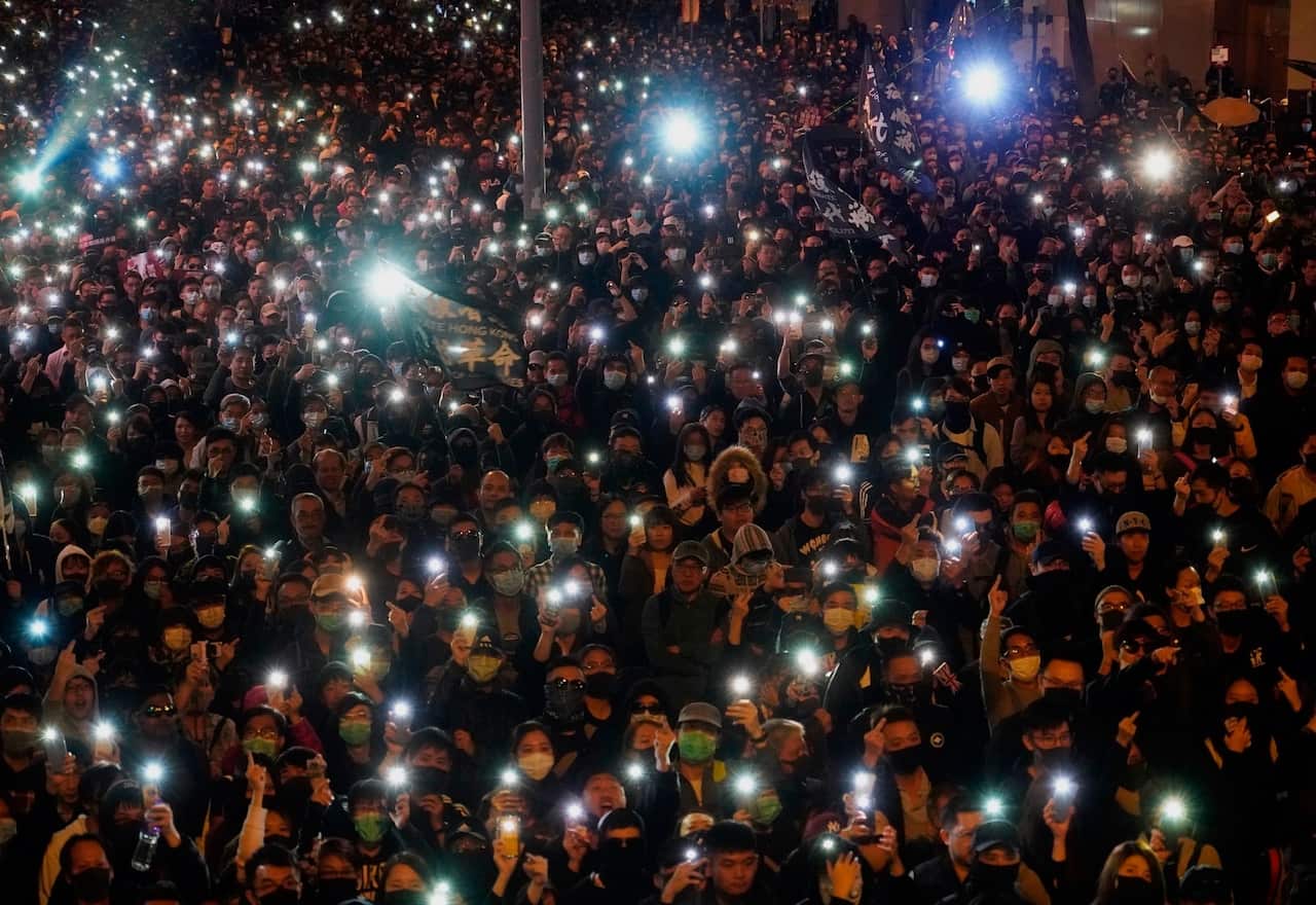 Pro-democracy protesters gather on a street in Hong Kong