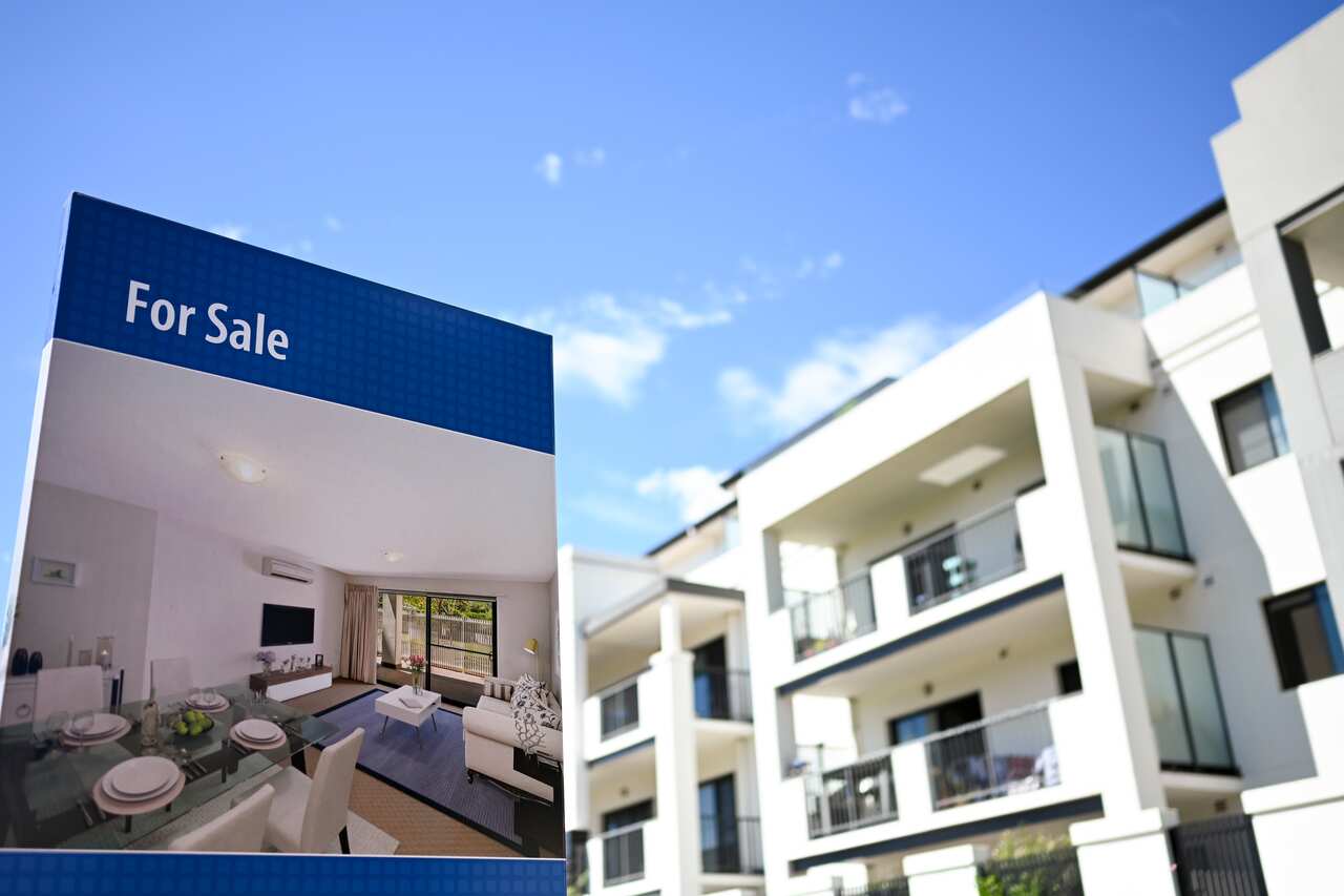 A real estate advertising board is seen next to a house in Canberra, Friday, March 1, 2019. (AAP Image/Lukas Coch) NO ARCHIVING