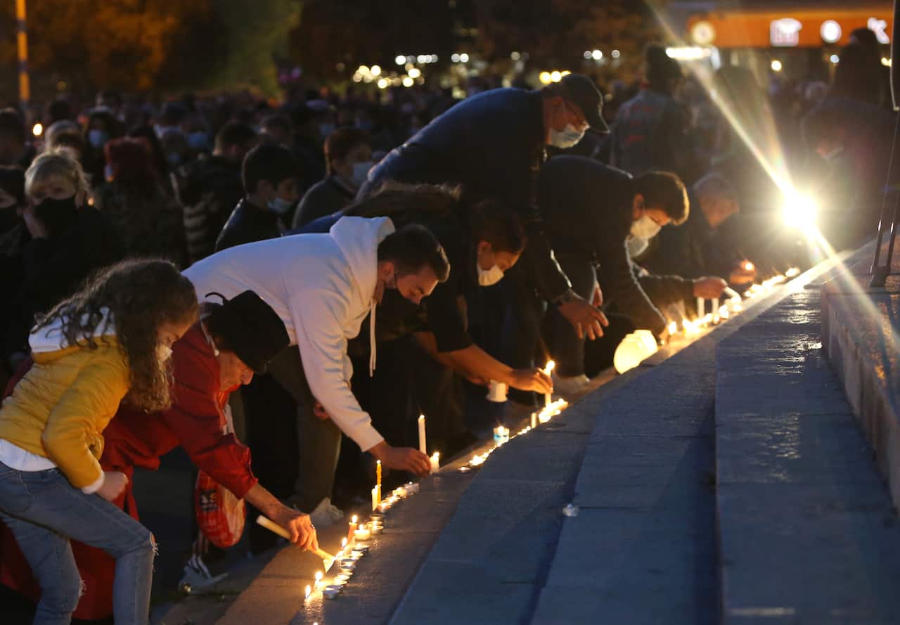 Armenian people attend a candlelight tributes to soldier at the Freedom Square in Yerevan, Armenia, 14 November 2020.