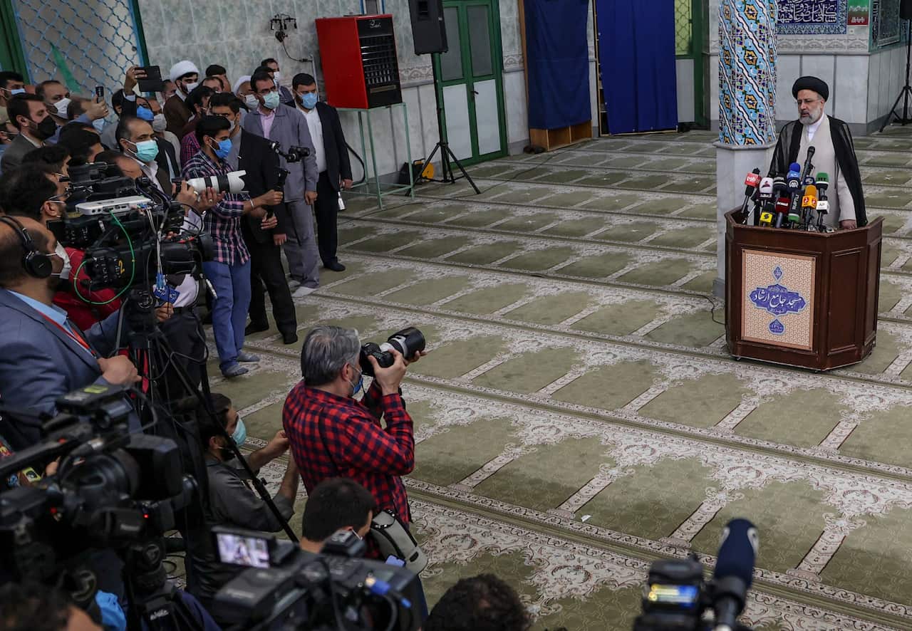 Ebrahim Raisi gives a news conference after voting in the presidential election, at a polling station in the capital Tehran, on 18 June.