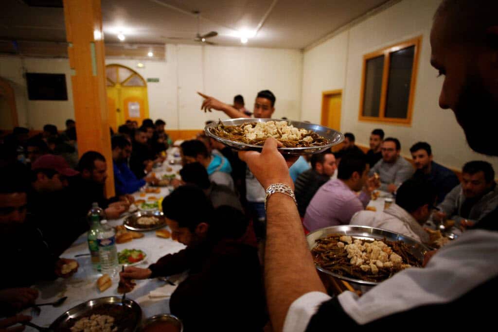 Meals are served as Muslims eat just after sunset during the Muslim holy month of Ramadan, on May 18, 2018.