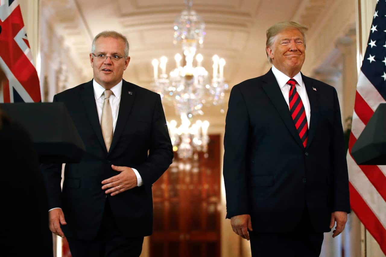 President Donald Trump and Australian Prime Minister Scott Morrison arrive at a news conference in the East Room of the White House, Friday, Sept. 20, 2019, in Washington. (AP Photo/Patrick Semansky)