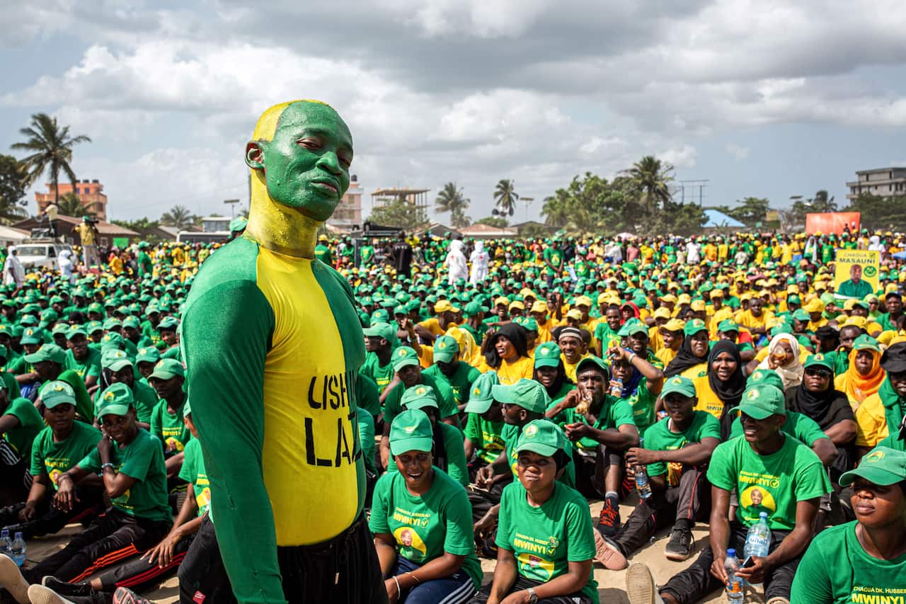 Supporters of the Tanzanian ruling party Chama Cha Mapinduzi gather at the Kibanda Maiti Stadium during the last campaign rally, in Stone Town on 25 October.