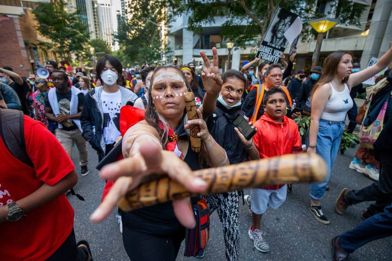 Protesters among thousands of participate in a Black Lives Matter rally in Brisbane. 