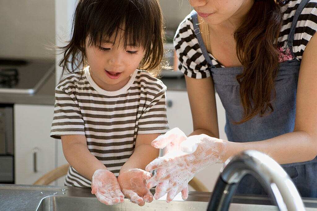 Mother and Son Washing Hands