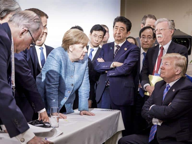 G7 leaders buttonhold President Trump at the G7 summit