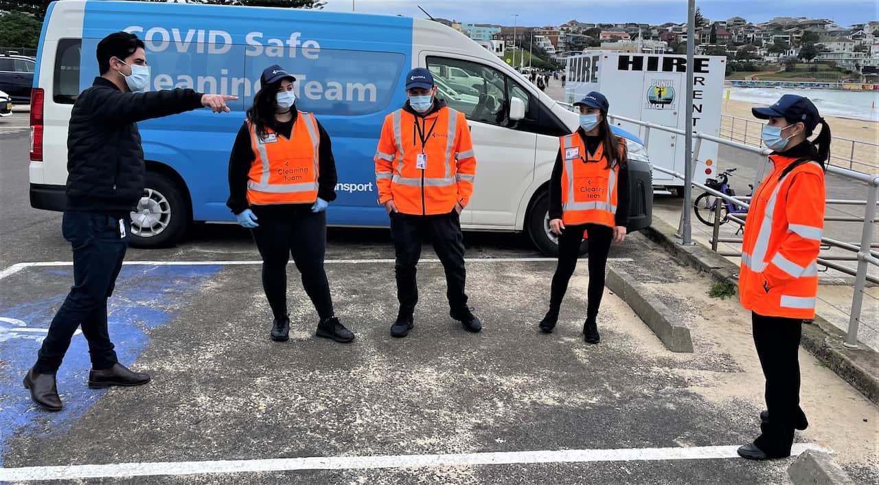 Badi with some of his team at Sydney's Bondi Beach