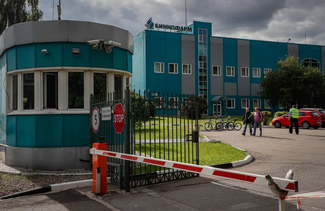 People walk in the Binnofarm factory, which is selected as the second manufacturer of Russia's new coronavirus vaccine.