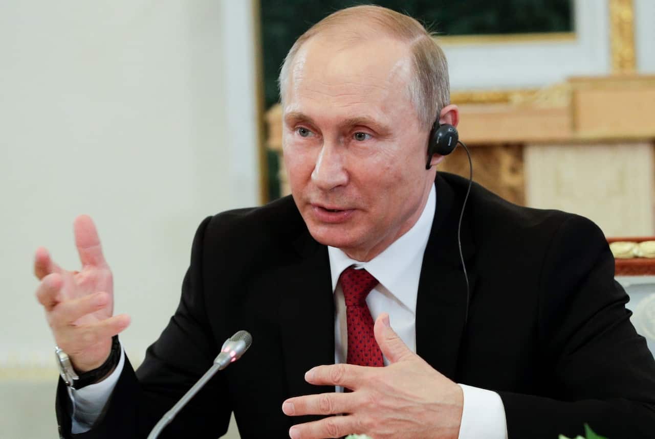 Russian President Vladimir Putin speaks at a meeting with heads of international news agencies at the St. Petersburg International Economic Forum