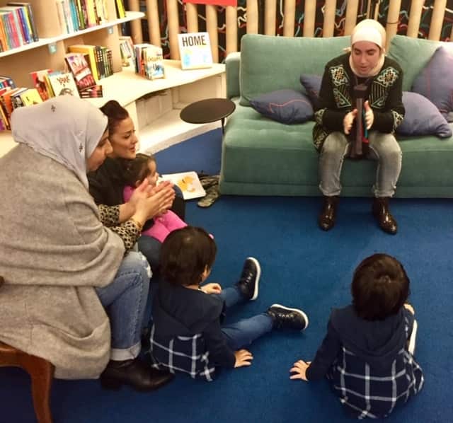 Local pre-schoolers and their families enjoy multi-lingual story time at Lost in Books. 