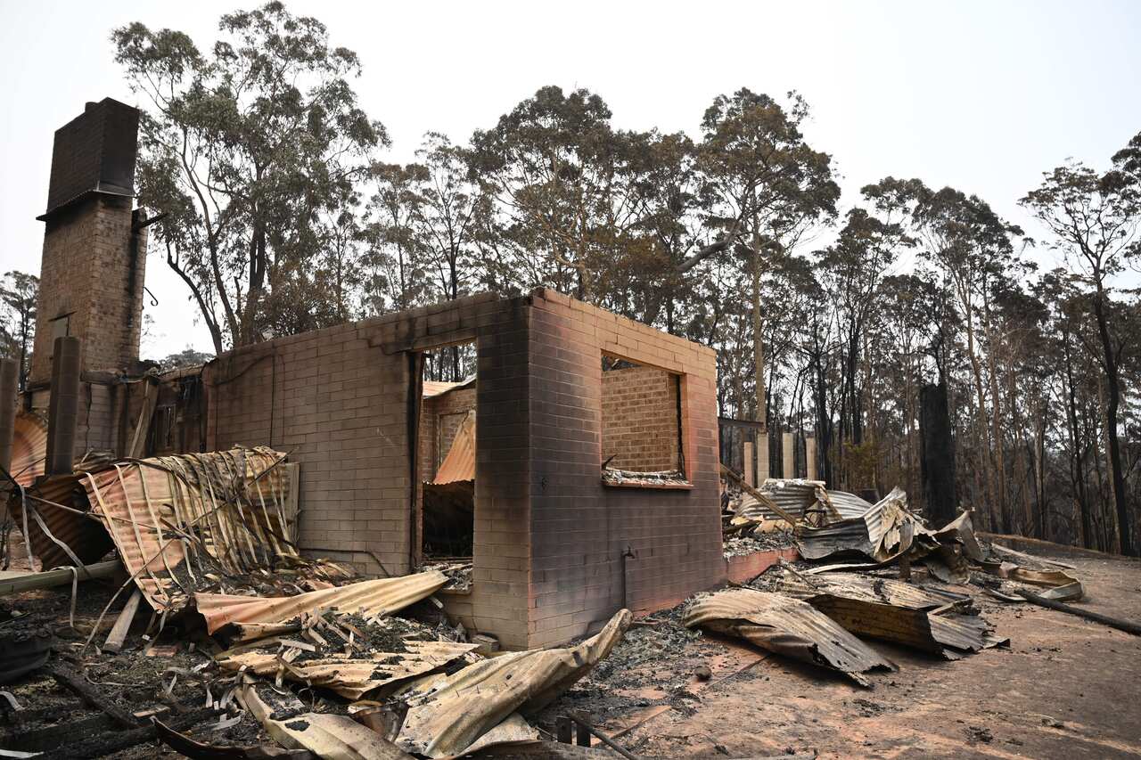 The remains of a house destroyed by a bushfire outside Batemans Bay.
