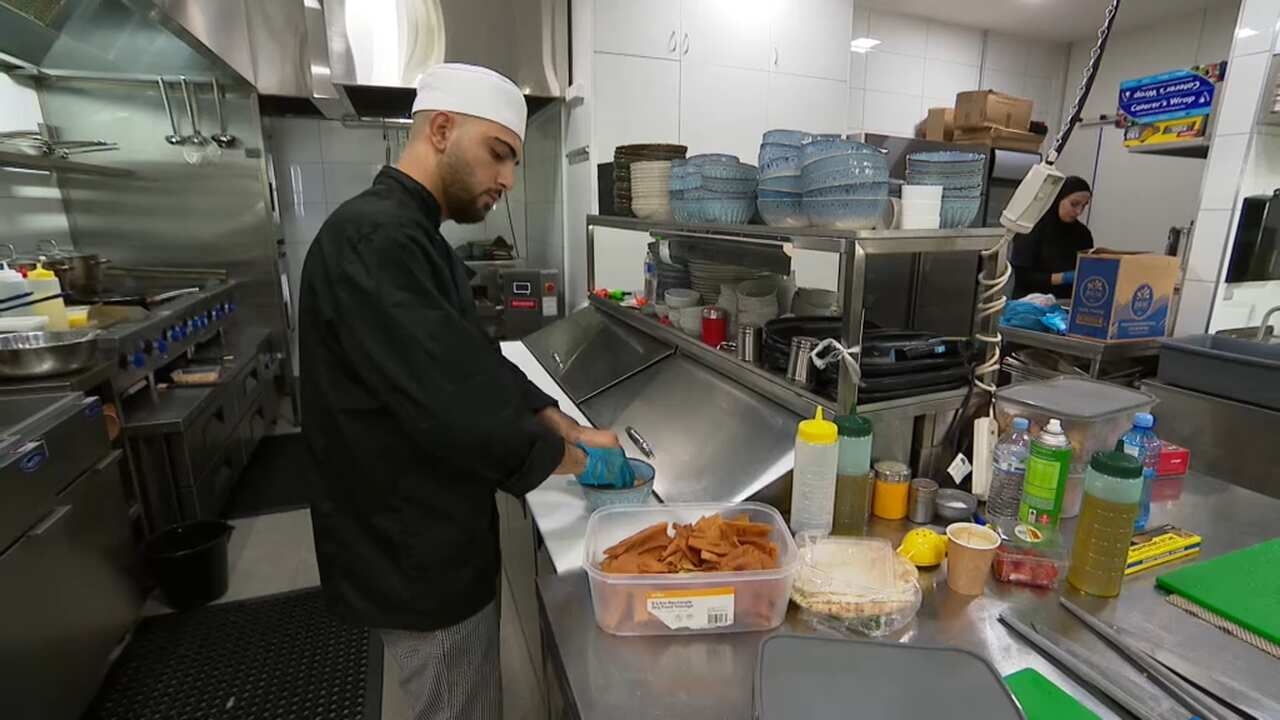 Chef cooking at Lazeez Lebanese Cuisine