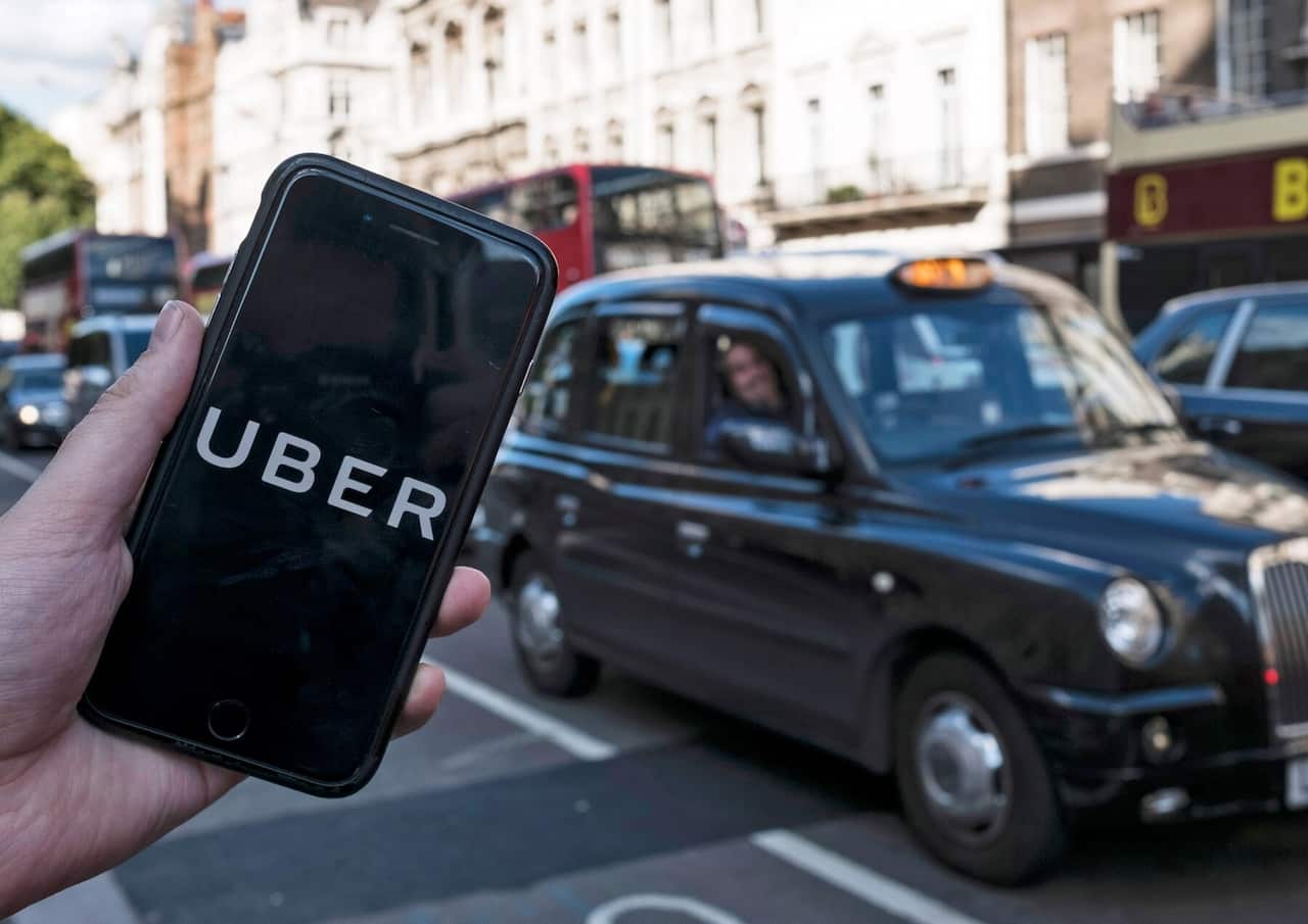 An Uber app on a mobile phone in central London 