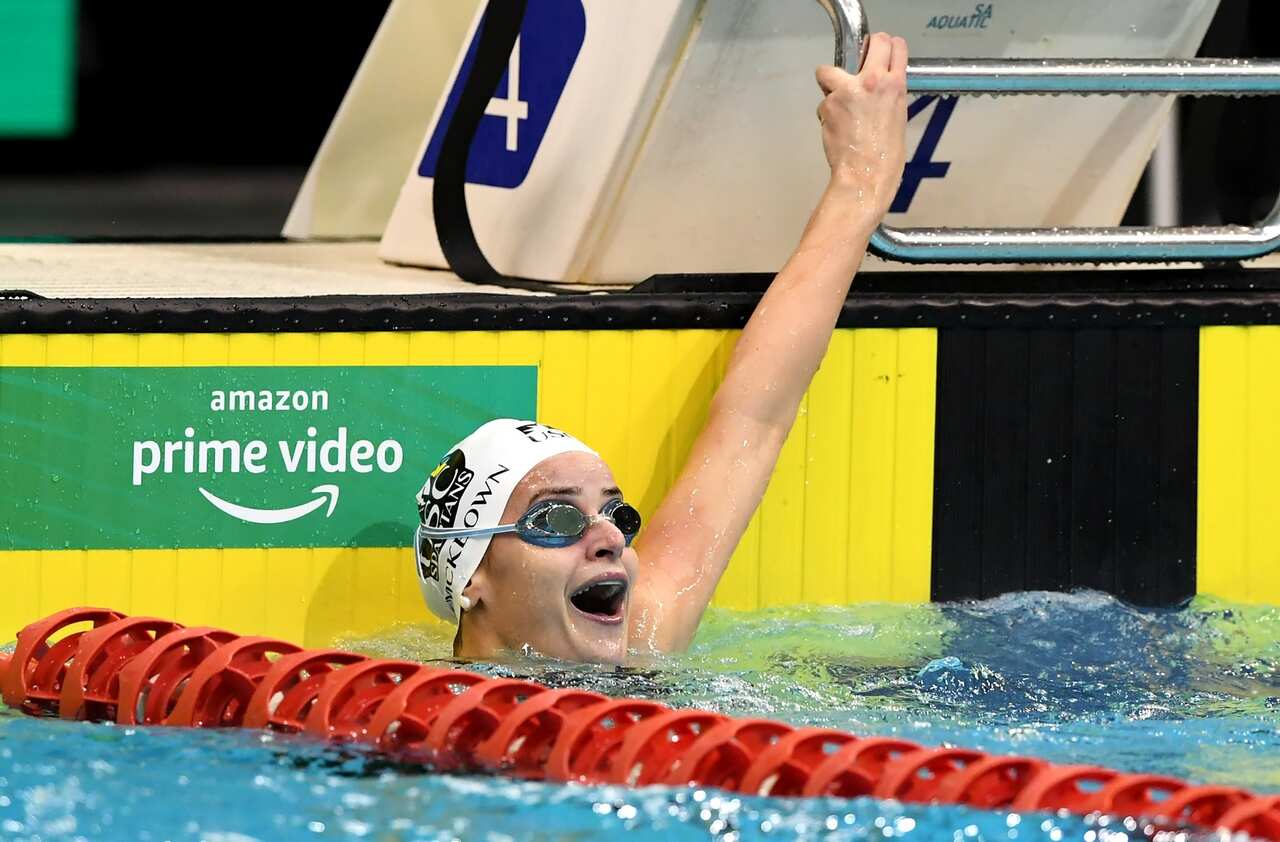 Kaylee McKeown reacts after setting a new world record in the womens 100m backstroke.