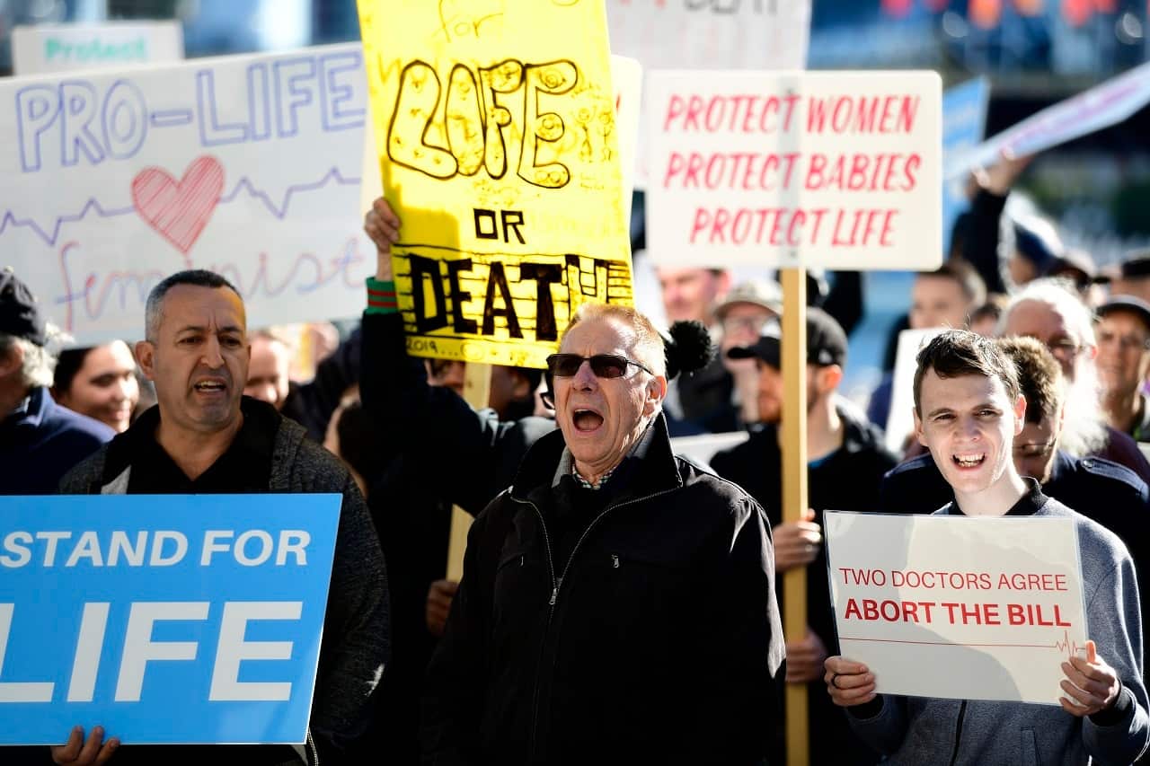 Protestors are seen holding placards at an anti-abortion rally on Saturday.