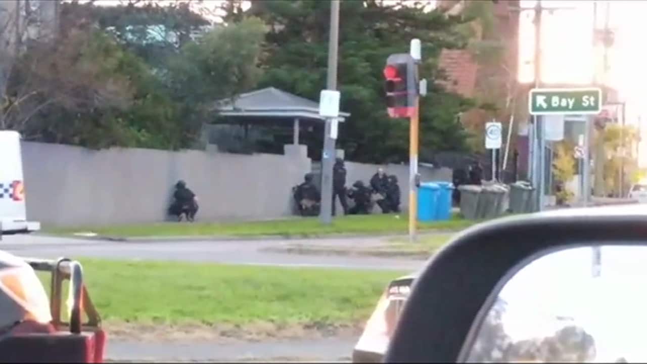 Victoria Police outside a Brighton, Melbourne residence during a hostage situation.