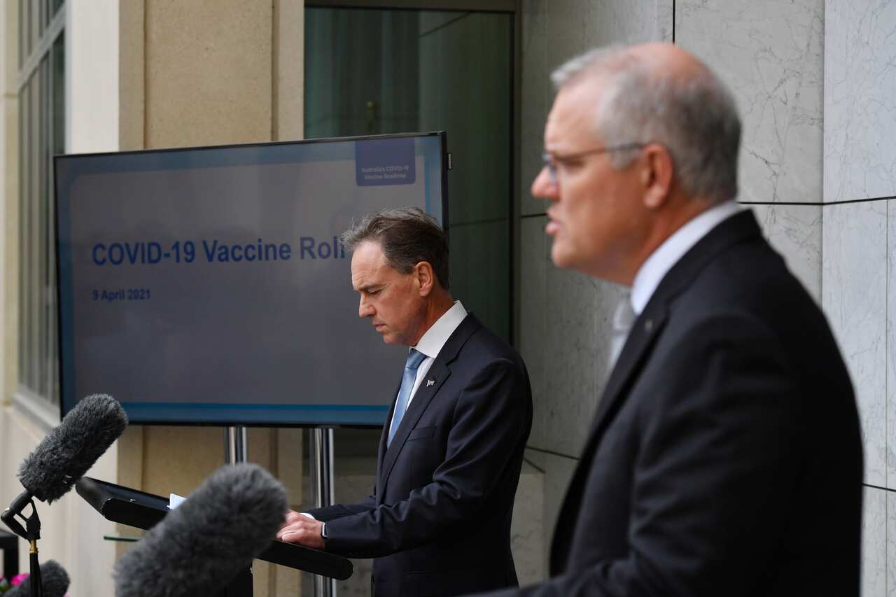 Health Minister Greg Hunt and Prime Minister Scott Morrison at a press conference at Parliament House in Canberra on Friday.