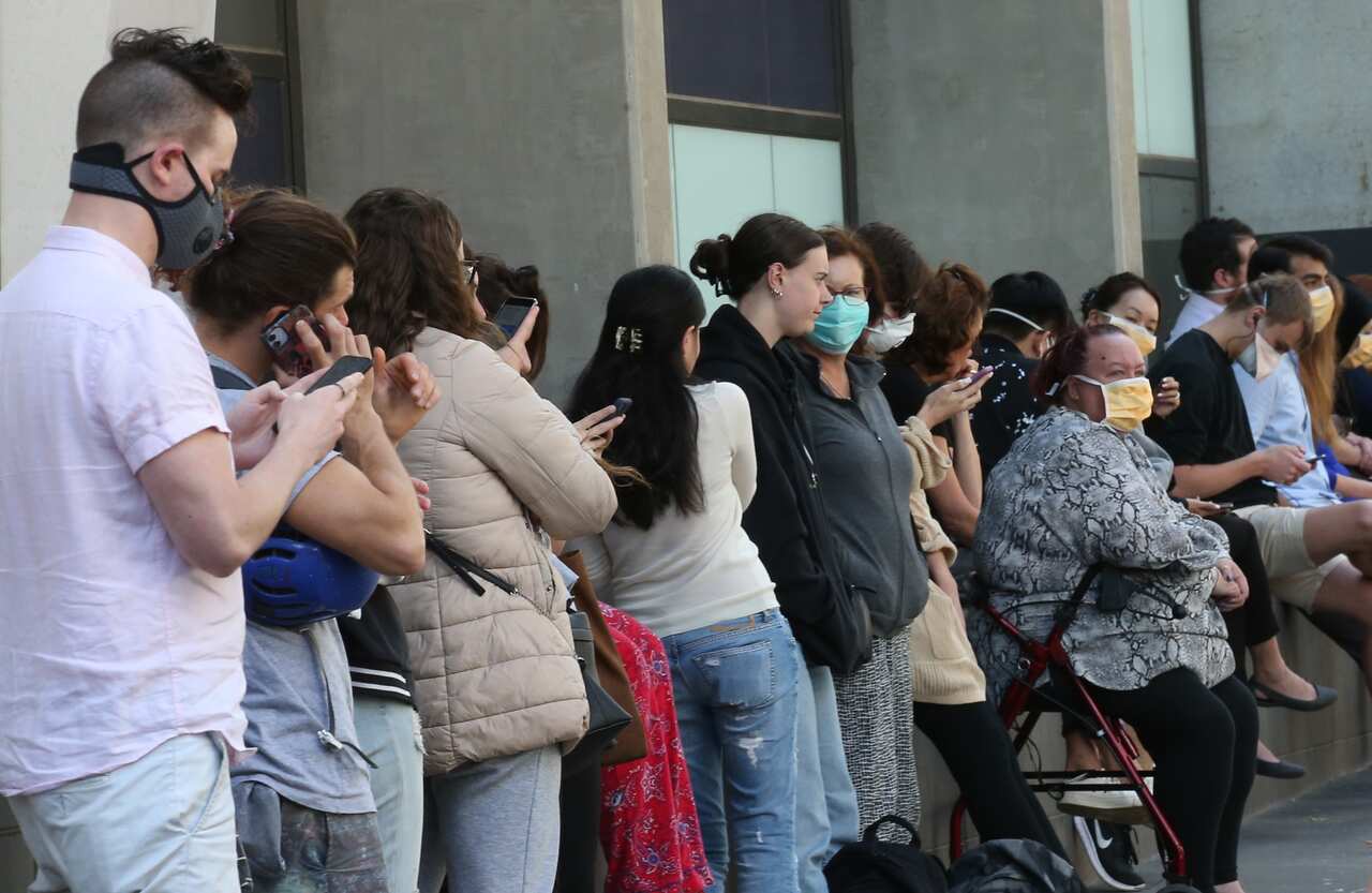 Patients line up at the Royal Melbourne Hospital for Coronavirus testing.