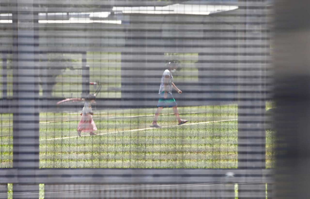 A woman and child seen inside the Christmas Island detention centre