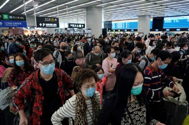 China has locked down millions of people in an effort to keep a lid on the situation. Pictured, people wear face masks at Hong Kong Airport.