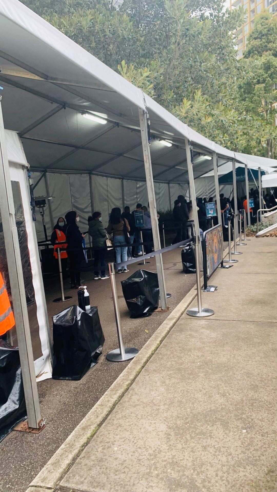 People queuing for their vaccinations at the Olympic Vaccination Centre