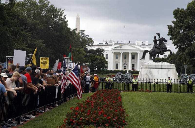 Demonstrators rally near the White House on the one year anniversary of the Charlottesville "Unite the Right" rally, Sunday, Aug. 12, 2018, in Washington