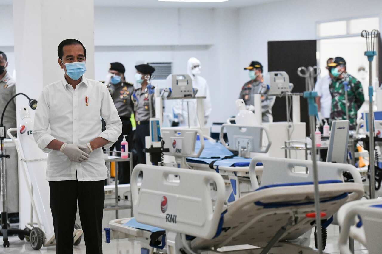 Indonesian President Joko Widodo inspects medical equipments at an emergency hospital set up amid the new coronavirus outbreak in Jakarta.