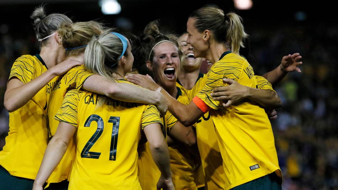 Caitlin Foord celebrates with team mates after scoring a goal during the second International friendly match between the Australia Matildas and Chile.