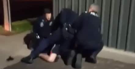 In the video a police officer appears to punch the man on the ground several times. 