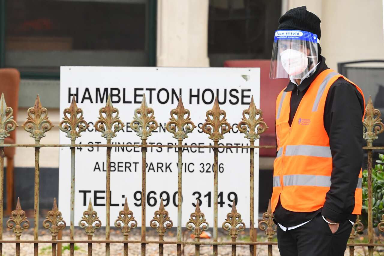 A security guard is seen outside of Hambleton House in Melbourne, Monday, August 17, 2020.                                                                                                                       