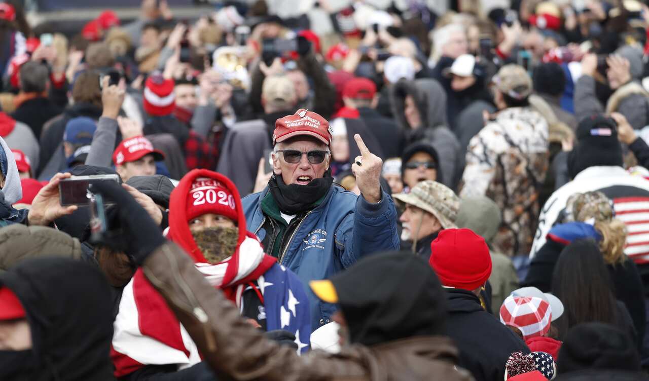 A supporter of Donald Trump's gestures towards the media at the rally