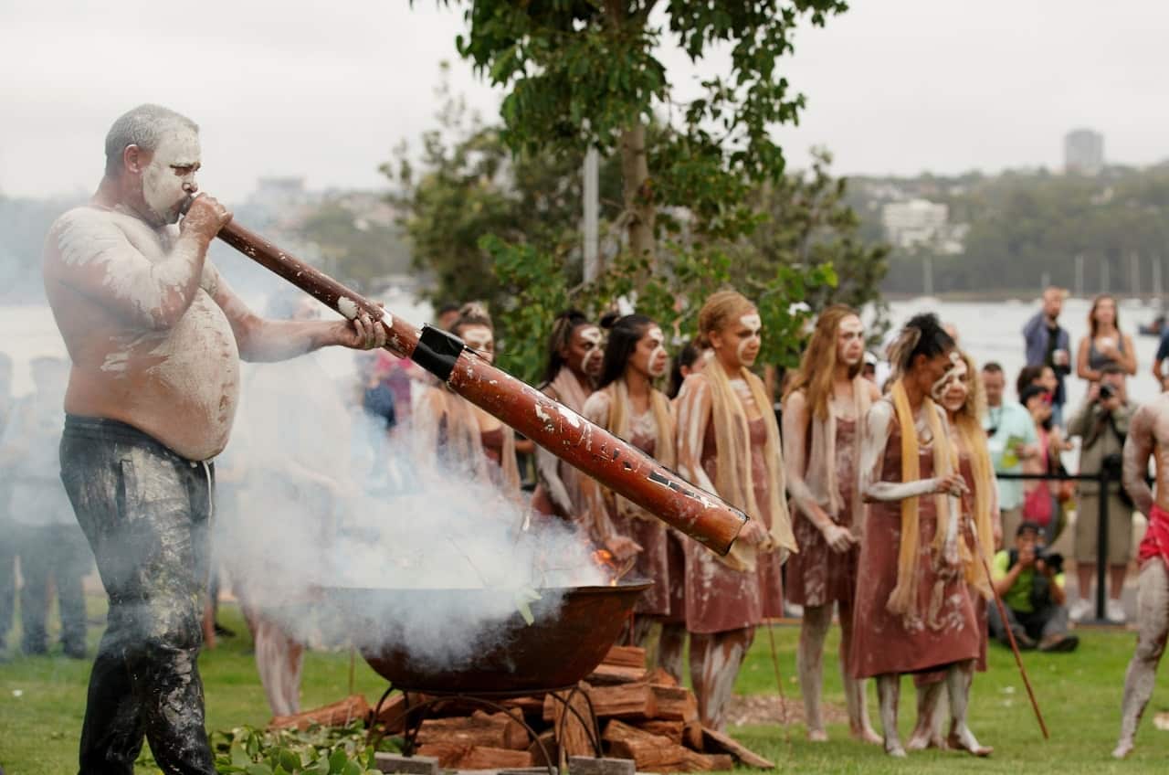 The Smoking Ceremony with Koomurri is performed during the Australia Day Wugulora Morning Ceremony on the Walumil Lawns at Barangaroo in Sydney, Friday, January 26, 2018. (AAP Image/Ben Rushton) NO ARCHIVING
