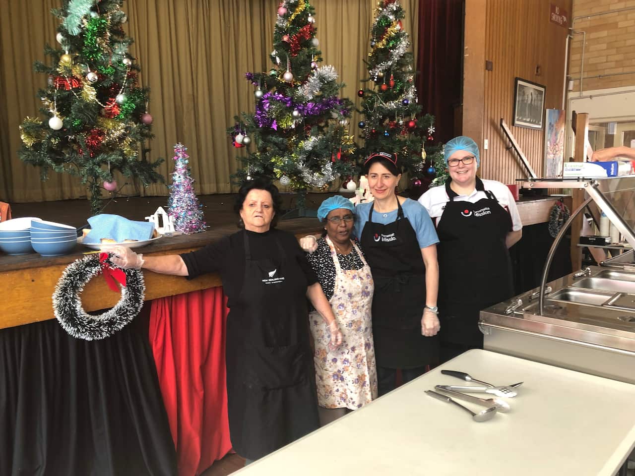 NSW Premier Gladys Berejiklian and Parramatta Mission volunteers on Christmas Eve.