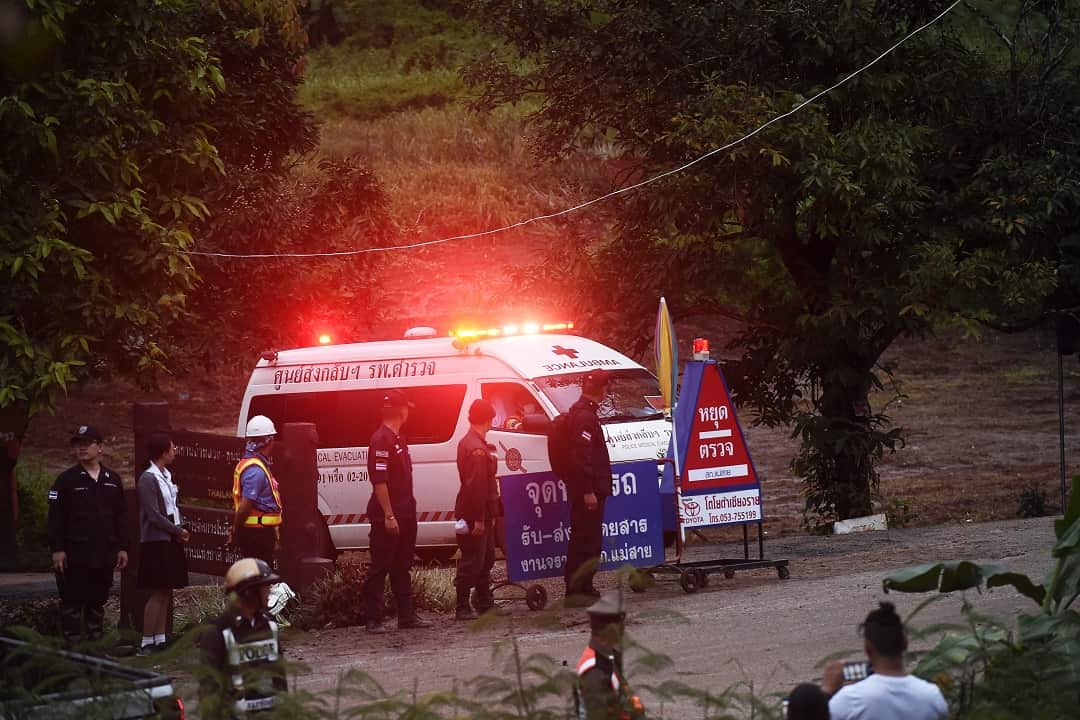 An ambulance leaves the Tham Luang cave area after divers evacuated some of the 12 boys and their coach.