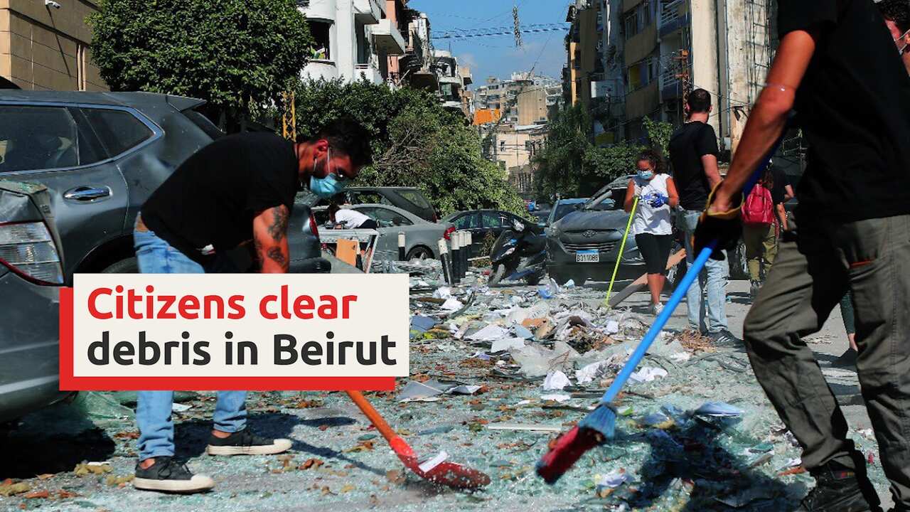 Citizen volunteers help to clear the debris from massive blast in Beirut