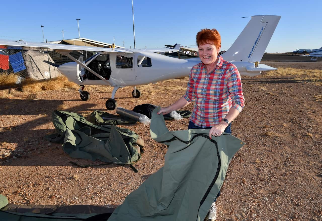 One Nation leader, Senator Pauline Hanson sets up camp in Birdsville next to the light plane which she travelled in on Thursday, August 31, 2017