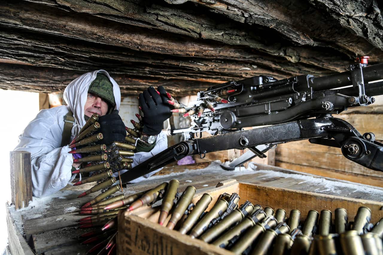 A serviceman checks his machine-gun in a shelter on the territory controlled by pro-Russian militants on the frontline with Ukrainian government forces.