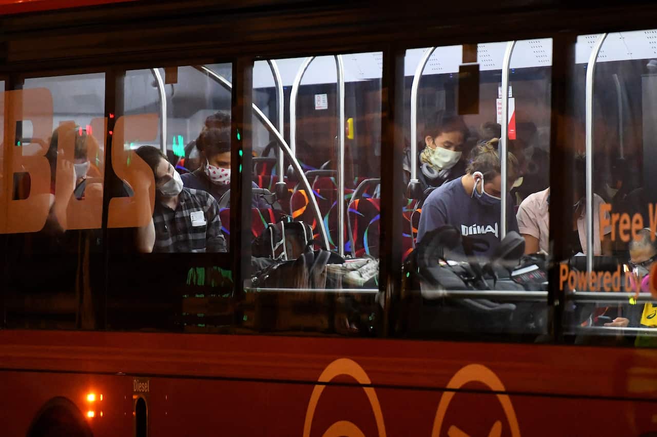 Australian travellers are carried on a bus 