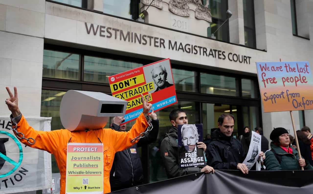 Supporters of Julian Assange demonstrate outside Westminster Magistrates' Court in London