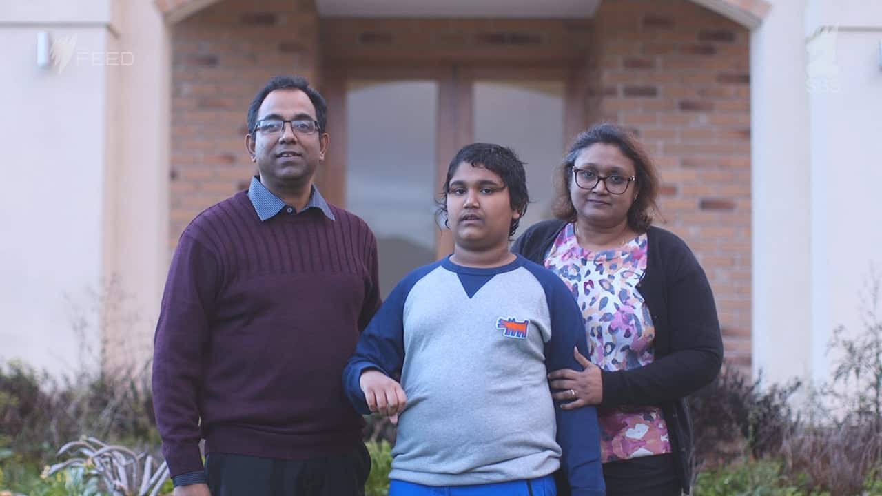 Biswajit Banik, Sarmin Sayeed and their 12-year-old son Arko.