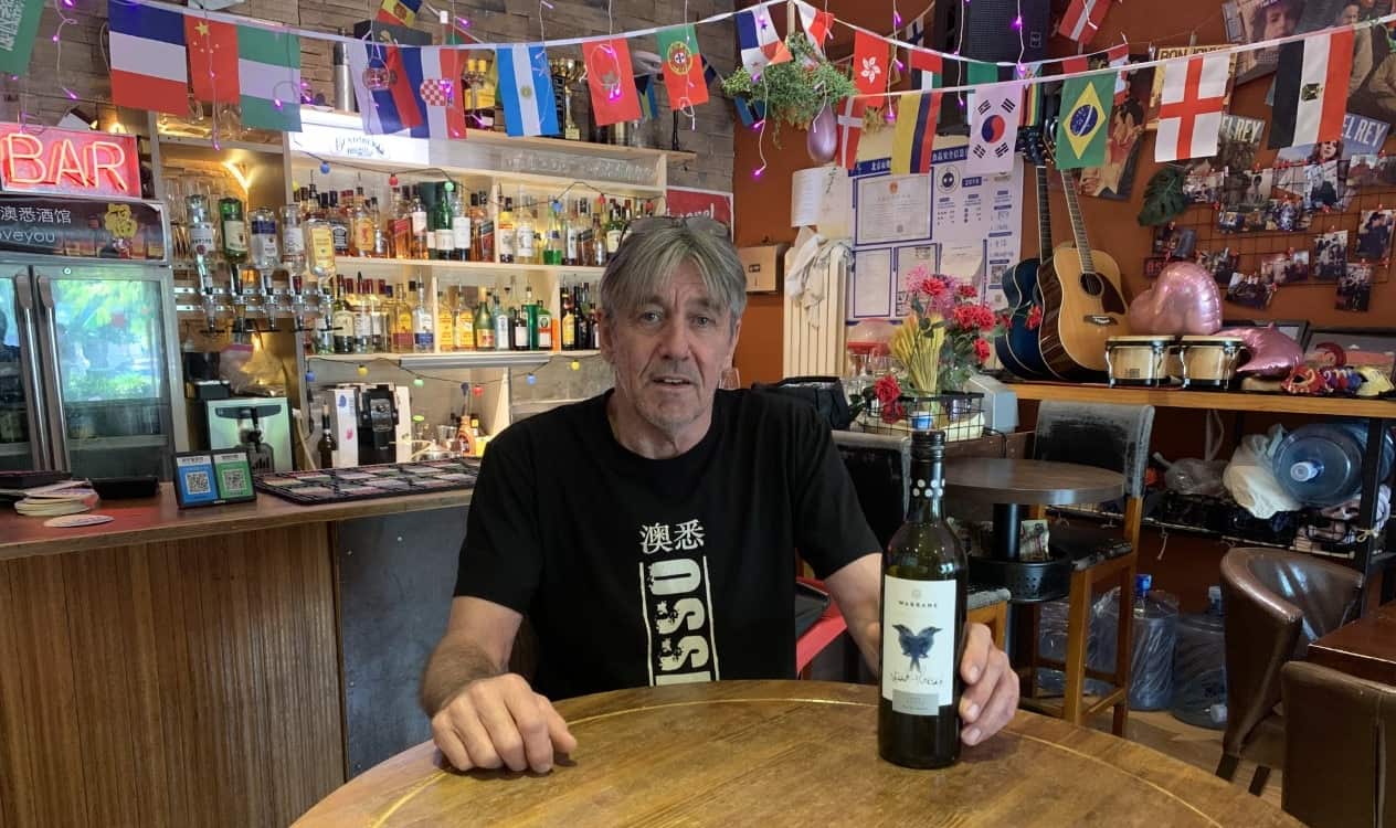 Queenslander Steve Goodey serves Australian wine at his bar in Beijing. 