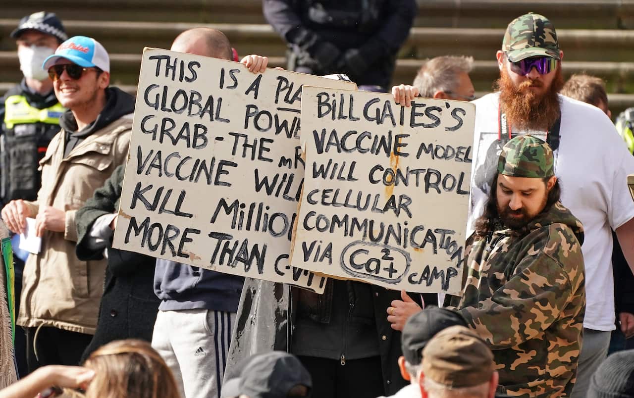 Protesters gather outside Parliament House in Melbourne on Sunday.