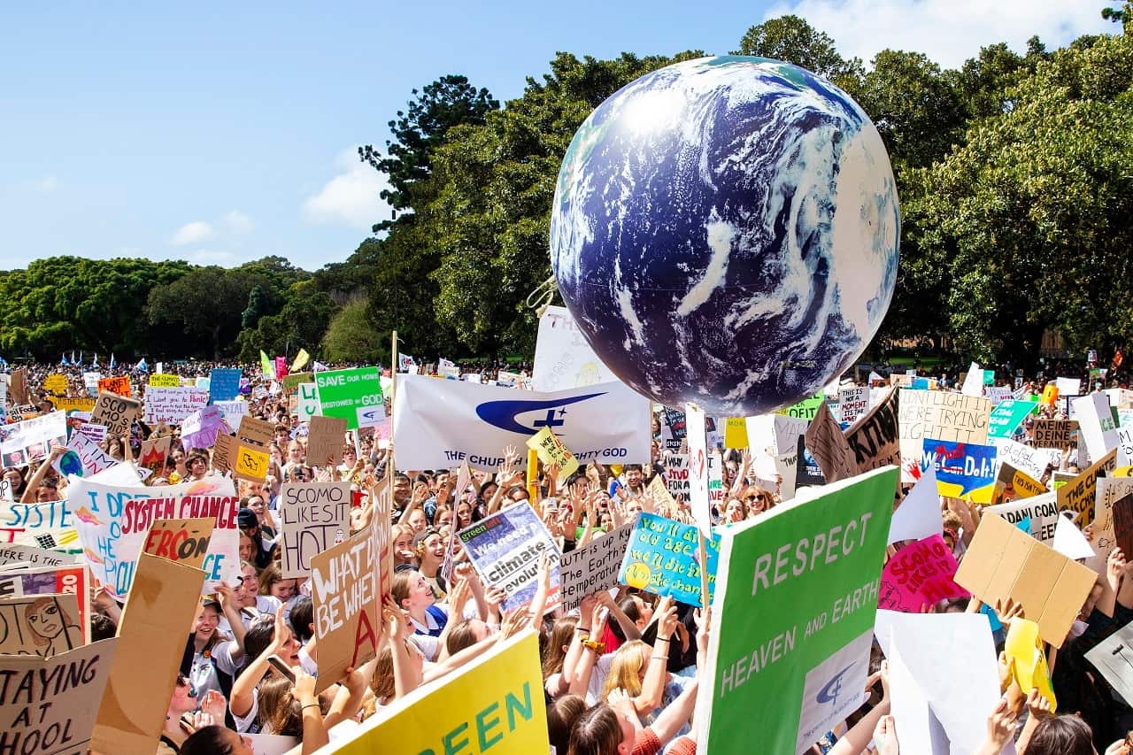 Thousands of school students and protesters gather in Sydney's Domain on Friday.