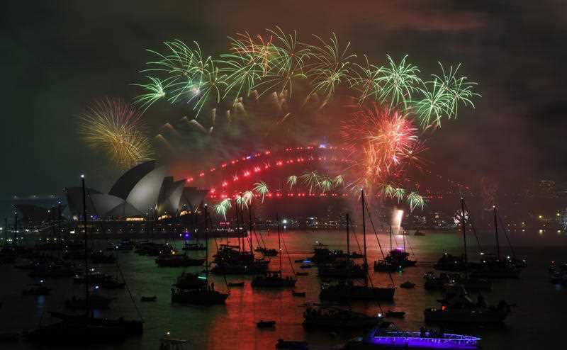 Sydney has welcomed 2018 with a dazzling display of pyrotechnics and a cascading rainbow waterfall.