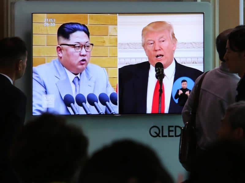 File image of people watching TV during an announcement of the summit